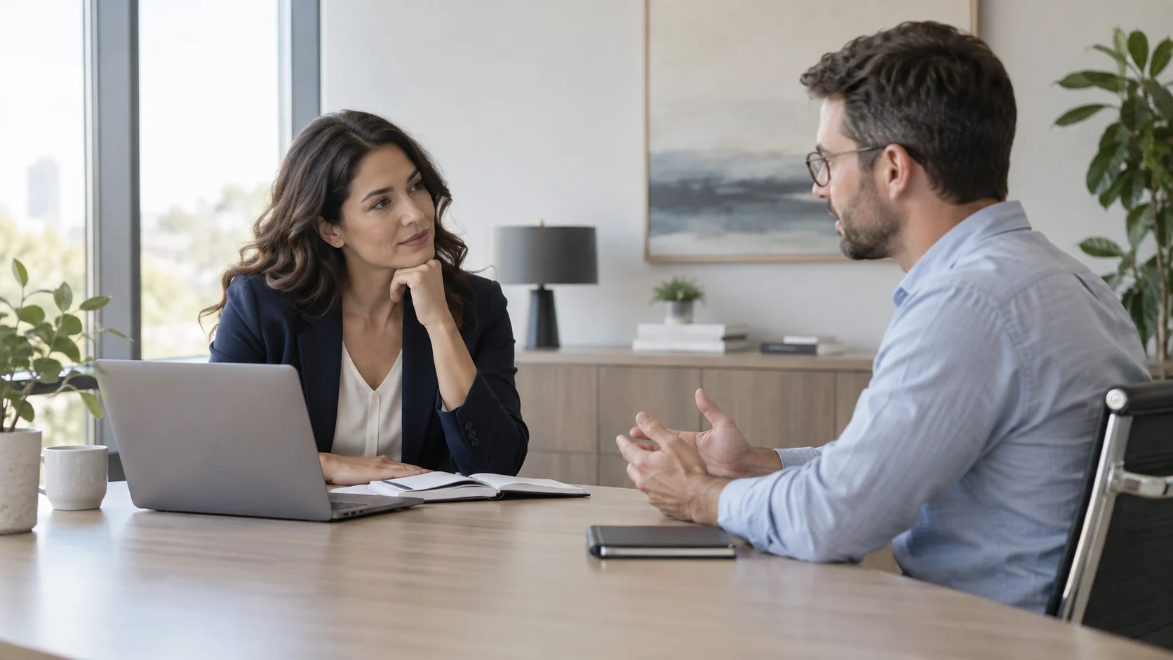 Professional listening attentively as a colleague explains a frustrating workplace concern